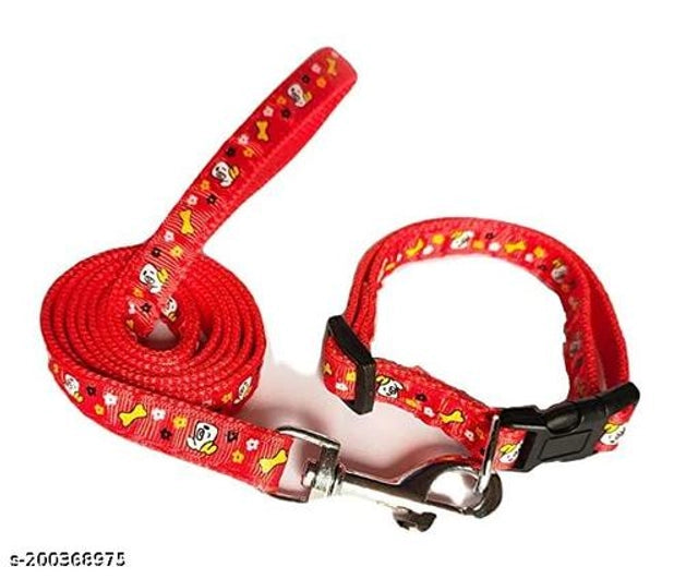 Red fabric dog body harness with 5-foot leash, size small, designed for pets, shown in a natural setting.