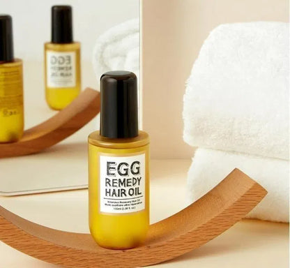 Baby hair oil in 18058 Egg Remedy Hair Oil 100ml pack, featuring gentle, nourishing formula for infant scalp and hair care.