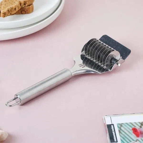 Stainless steel handheld dough and pasta cutter tool from brand 30969, with a handle and adjustable blades for noodle making.
