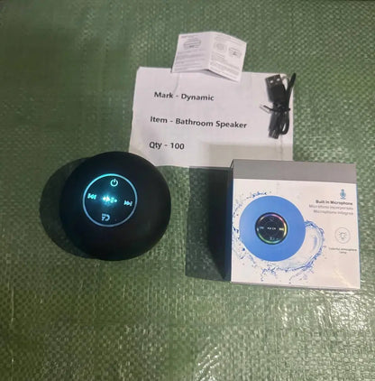 Large waterproof Bluetooth speaker with suction cup, branded 1238, shown mounted on a surface, ready for pool or shower use.