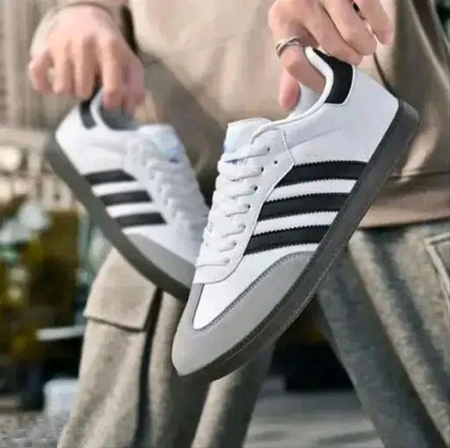 Anjrs Men's Casual Shoes by 1889, stylish and comfortable running and casual shoes for boys and men, shown in a natural pose.