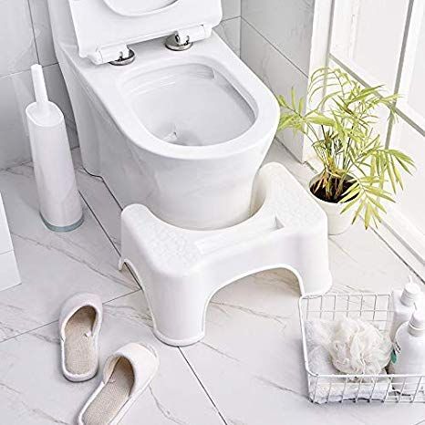 Plastic squat stool for Western toilets, designed to help with proper posture during toilet use, featuring a sturdy, compact design.