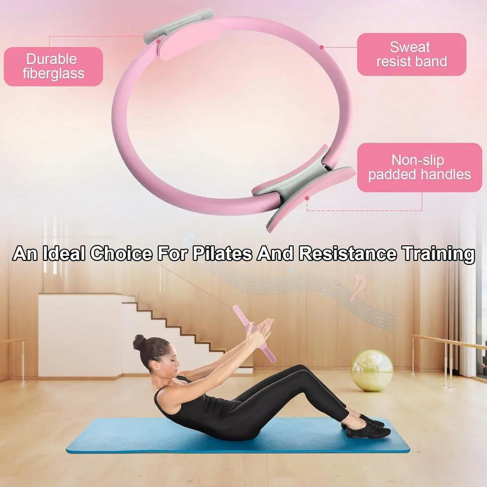 Pink exercise Pilates ring from 1238 for full-body workouts, shown in a close-up with hands gripping the resistance ring.