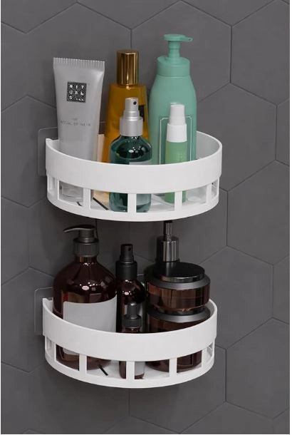 Two white corner bathroom shelves from 35561, mounted in a modern bathroom corner for storage and organization.
