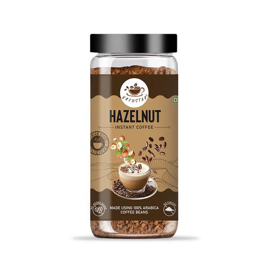 Brewstar Crunchy Hazelnut coffee in a clear glass coffee pot with a black handle, showcasing its rich color and creamy texture.
