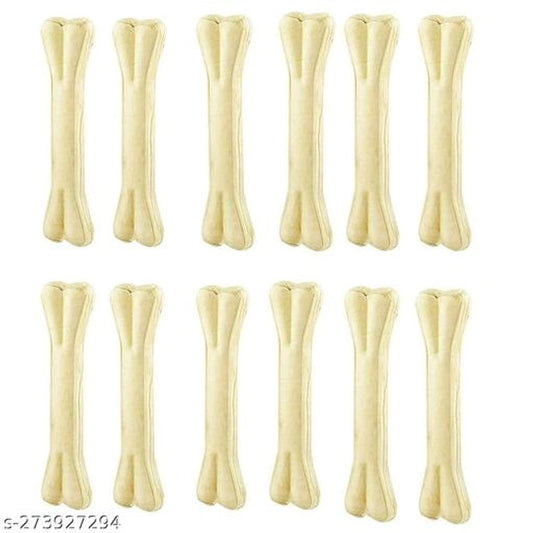 Rawhide bone treat for pets, 800g, from 15929, shown alongside a pet bed, highlighting the treat's size and texture.