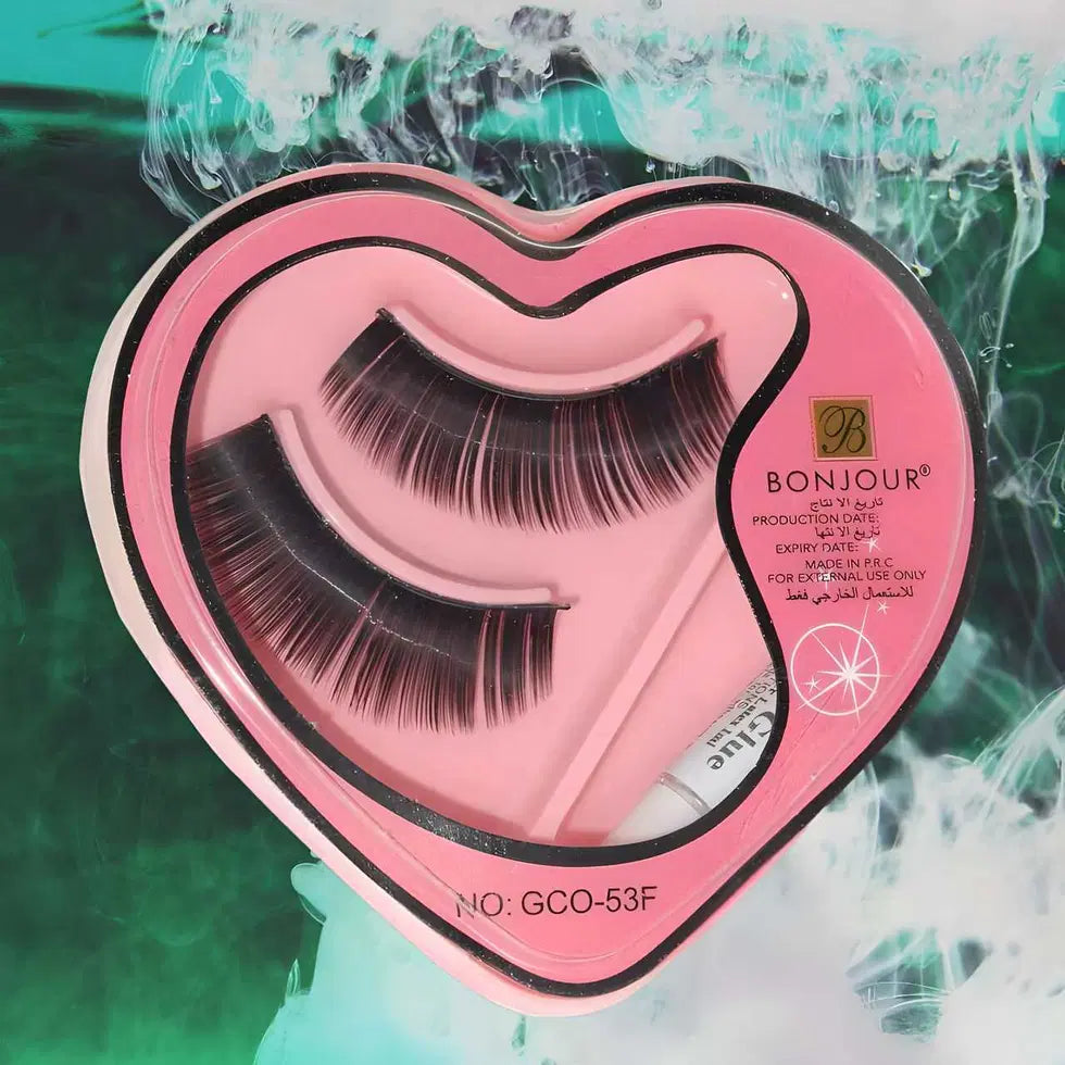 Close-up of 1238 Bonjour 3D false eyelashes with glue, showing layered, natural-looking false eye lashes on a white background.