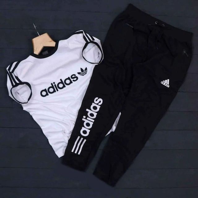 Men's Adidas summer tracksuit in white and black, casual athletic tracksuit with zip-up top and matching pants, front view.