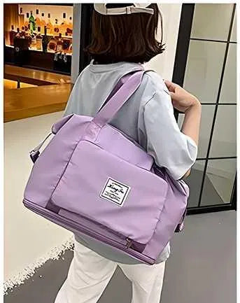 Foldable waterproof travel duffel bag by 26041, showing its compact, durable design with adjustable shoulder strap and water-resistant material.
