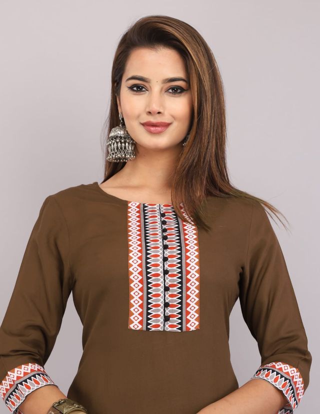 Elegant women's Kurti from brand 6164 with intricate patterns, showcased on a model in a vibrant, stylish design.