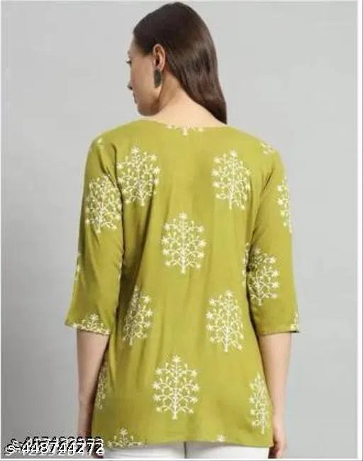 Green printed rayon short kurti for girls and women, casual women's kurti with floral design and short sleeves.