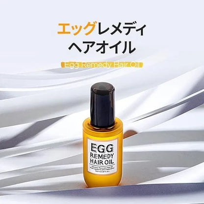 Baby hair oil bottle labeled Egg Remedy Hair Oil by 18058, 100ml, with a clear view of the packaging and branding.