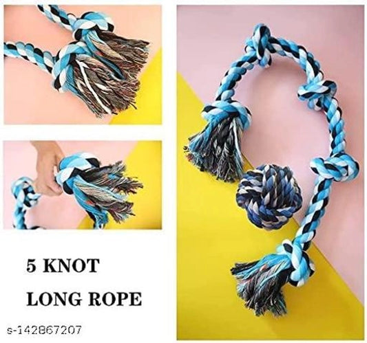 Multicolor cotton knot pet toy in a soft pet bed, featuring a woven knot design for dogs or cats.