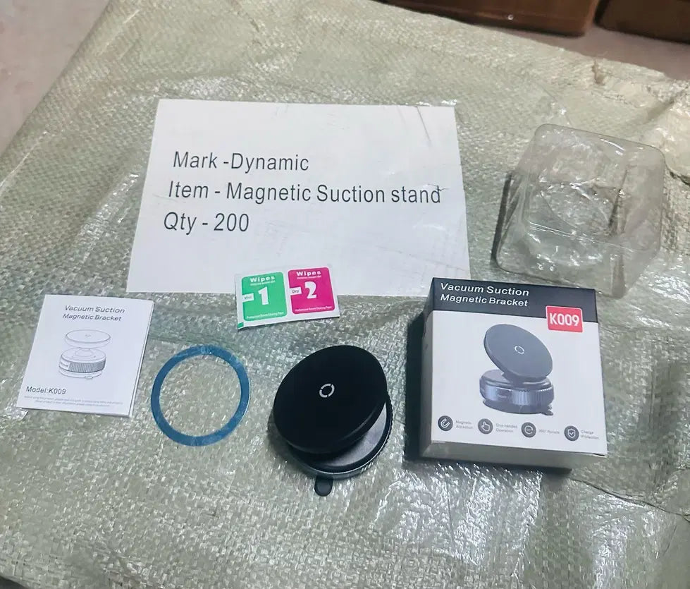 Magnetic suction phone holder for car by 1238, shows a black mobile device securely mounted on a sleek car dashboard.
