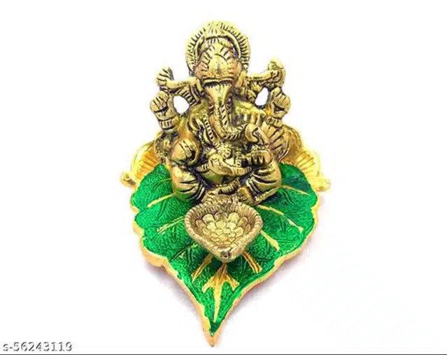 Brass God Ganeshji diya set with green accents, traditional diyas for festive lighting and worship, showcasing intricate design.
