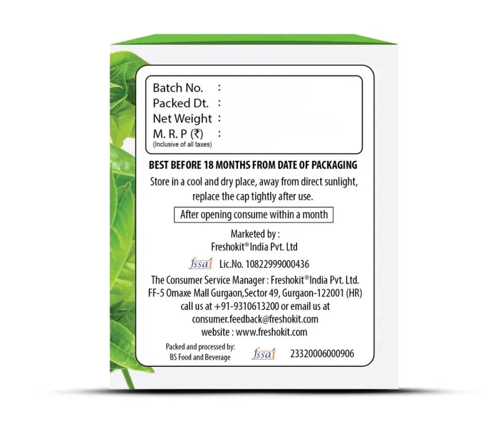 Freshville Green Tea Bag inside a classic ceramic tea pot, showcasing fresh green tea leaves and brewing process.