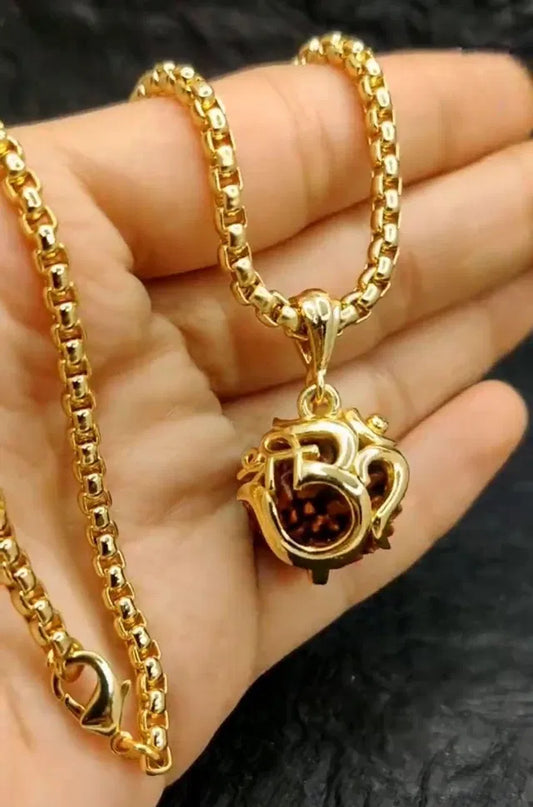 Golden Om Rudraksha pendant with chain for women, featuring intricate design, ideal for spiritual jewelry and everyday wear.