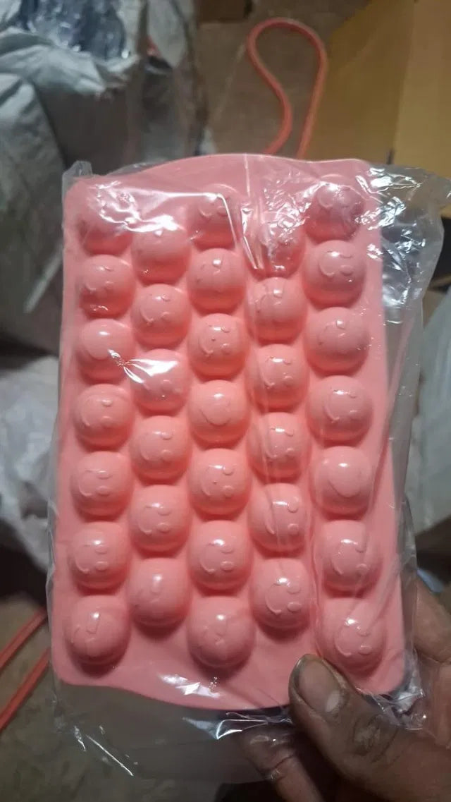Plastic reusable flexible round ice cube tray, 18896 brand, showing multiple round ice molds filled with water ready to freeze.