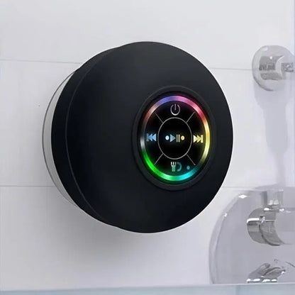 Large waterproof Bluetooth speaker from 1238 with suction cup design, ideal for outdoor or shower use.