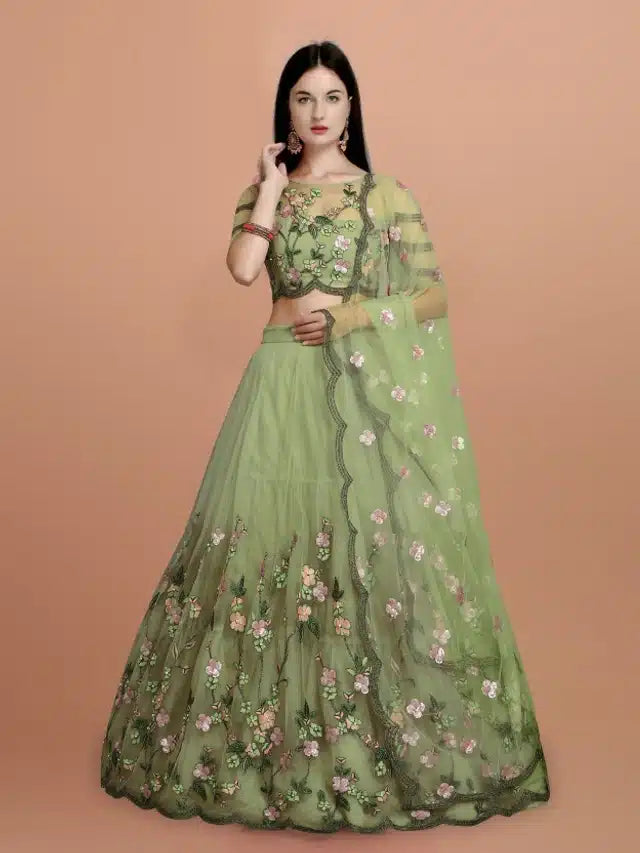 Green embroidered semi-stitched women's lehenga choli with intricate net embroidery, featuring detailed craftsmanship.