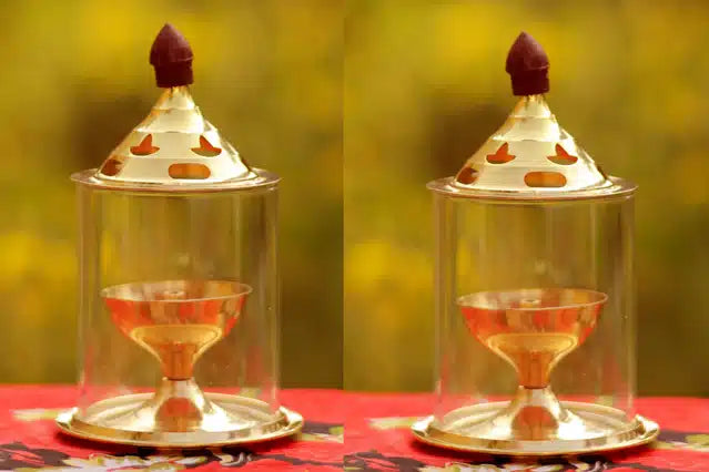 Set of two brass oil puja lamps with gold finish, 5-inch diyas for religious rituals and spiritual decoration.