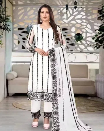 Women’s kurta set with matching dupatta and bottomwear, stylish ethnic wear from 15801, featuring intricate embroidery and vibrant fabric.