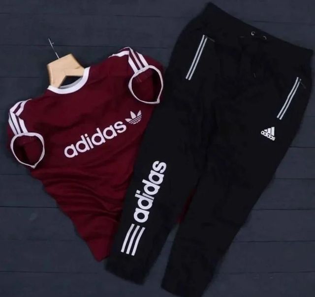 Maroon and black Adidas men's summer tracksuit with zip-up jacket and matching joggers, casual athletic wear.
