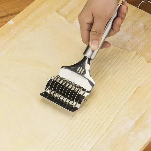 Stainless steel handheld dough and noodle pasta cutter tool from 30969 kitchen tool set, with sharp blades for slicing dough or noodles.