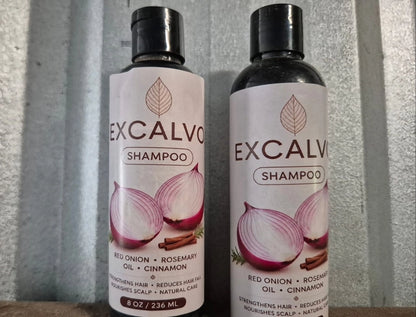 Pair of Excalvo Onion Shampoo bottles by 35912 with labels, showcasing clear bottles and shampoo inside.