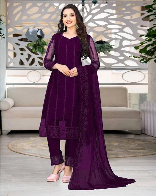 Elegant women's kurta set with matching dupatta and bottomwear, featuring intricate embroidery and vibrant fabric from 15801.