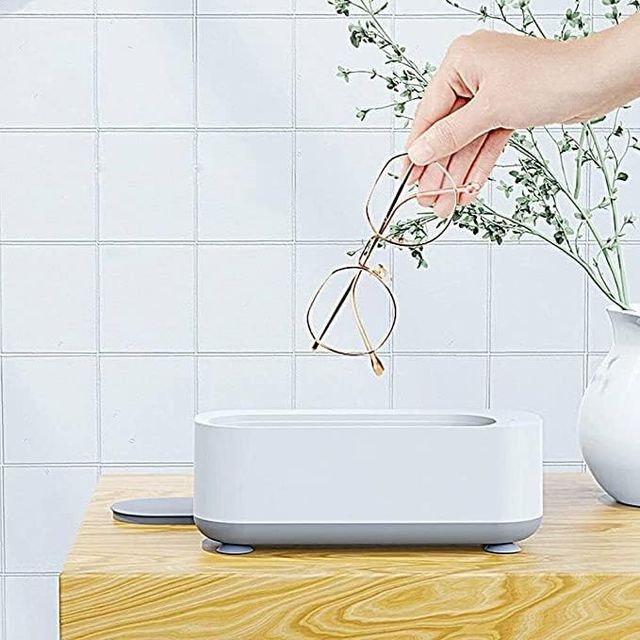 Mini ultrasonic jewelry and glasses cleaning machine from 26072, compact device with stainless steel cleaning chamber and control buttons.