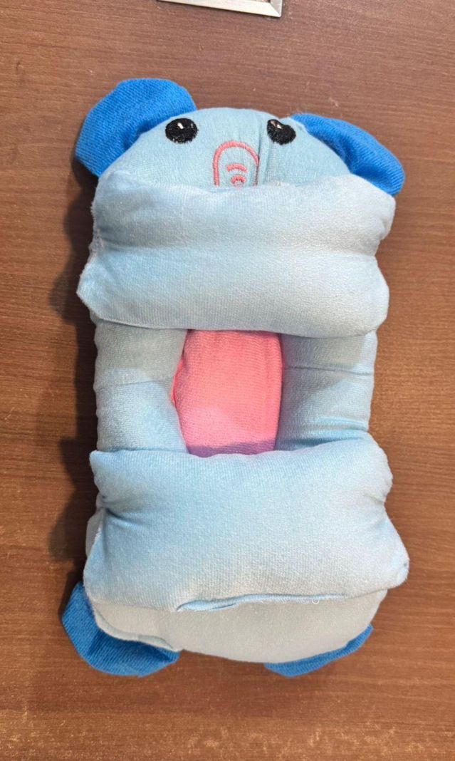 Baby shaping head support pillow in assorted colors, designed for infant comfort and proper head alignment.