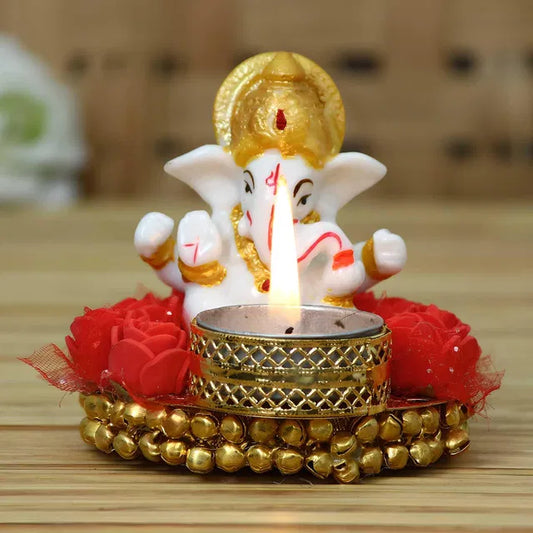 Decorative Lord Ganesha idol on a plate with tea light holder, intricate design, perfect for spiritual or festive decor.