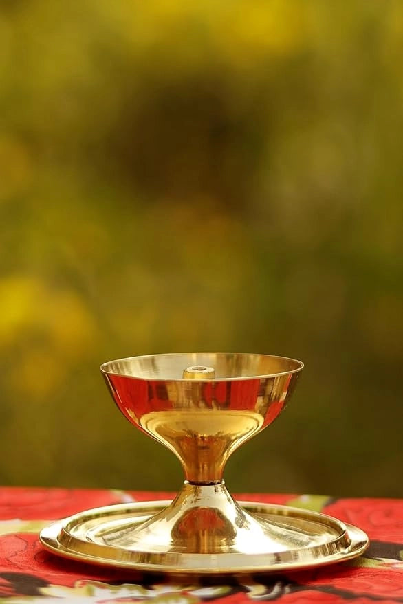 Brass and glass Akhand Deep Diya with cover for Pooja, oil lamp for puja ceremonies, featuring intricate design and traditional style.