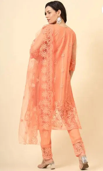 Elegant women's kurta set with matching dupatta and bottomwear, featuring intricate embroidery and vibrant fabric.