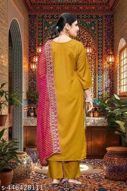 Elegant women's kurta set with matching dupatta and bottomwear from 15801, featuring traditional design and vibrant fabric details.