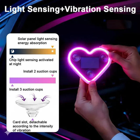 Heart-shaped car window light with suction cups, solar-powered cycle light and reflector by 34141, attached to a vehicle window.