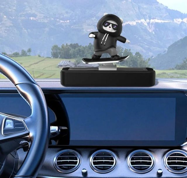 Colorful car dashboard decorative showpiece with intricate figurine design, perfect for enhancing vehicle interior decor.