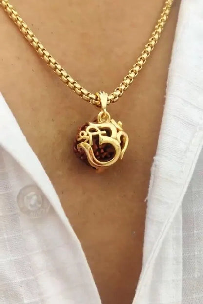Women’s Om Rudraksha pendant with chain, featuring a sacred bead design, on a silver-tone chain in a close-up view.