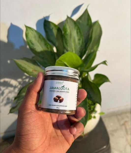 JamalGota Ayurvedic Hair Growth Tonic in a 100g bottle, designed to promote hair health and growth.