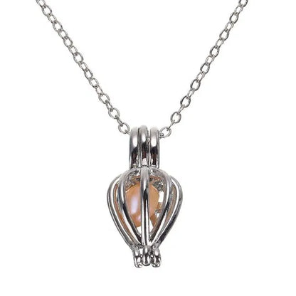 Freshwater shell and real pearl necklace set for kids with ocean-themed design, featuring a charm and delicate chain.