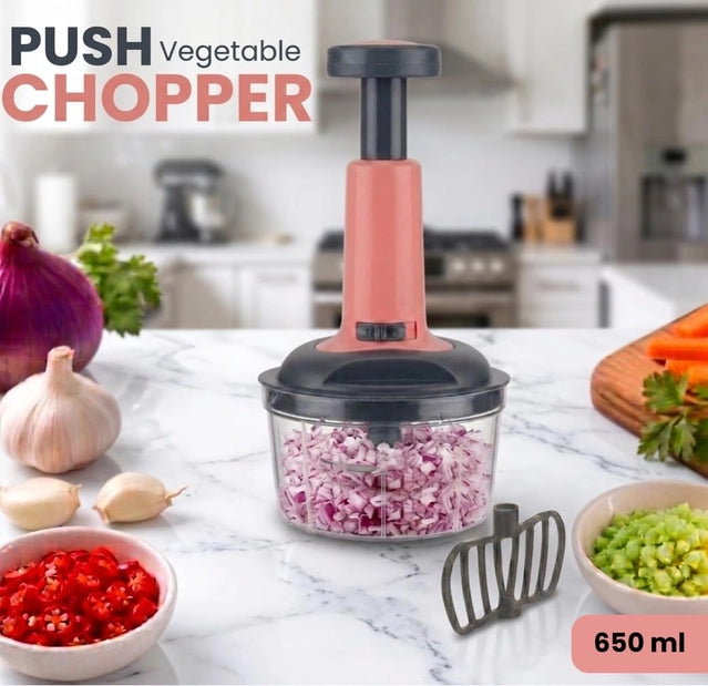 Manual vegetable chopper with 650ml capacity and 3-tier stainless steel blades, in a compact design by 35561.