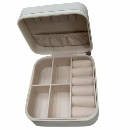 Rectangle peach leather jewelry and makeup kit box from 19357 with compartments for organizing accessories and cosmetics.