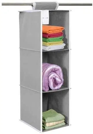 Hanging cloth organizer with three shelves for wardrobe storage, ideal for organizing clothing and accessories.