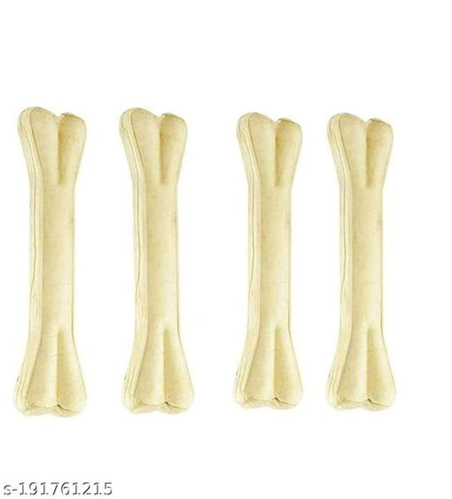 Rawhide dog bone treat, 3 inches, in a pack of four, with a plush pet bed in the background, ideal for dogs' chewing and comfort.