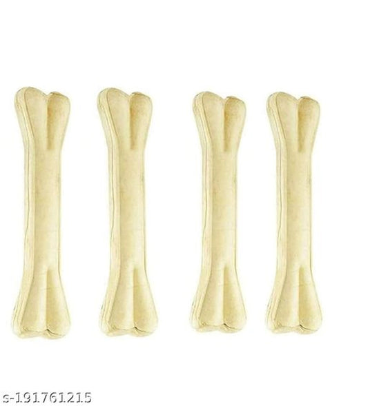 Rawhide dog bone treat, 3 inches, in a pack of four, with a plush pet bed in the background, ideal for dogs' chewing and comfort.
