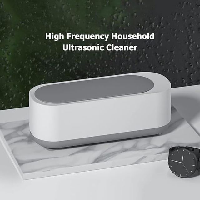 Mini ultrasonic jewelry and glasses cleaning machine from 26072, compact device with stainless steel tank and control buttons.