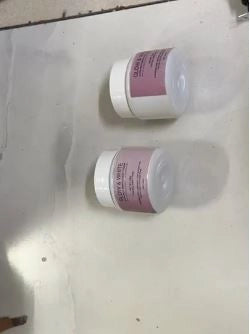 Two bottles of 35930 Glow & White Cream for all skin types, showing the creamy texture and white packaging.