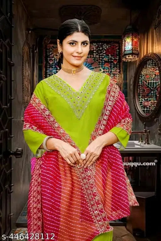 Women's kurta set with matching dupatta and bottomwear from brand 15801, featuring traditional design and vibrant fabric.