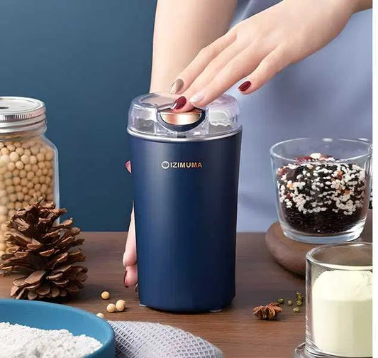Electric coffee grinder by 1238 with a random color finish, featuring stainless steel blades and compact design for fresh coffee.